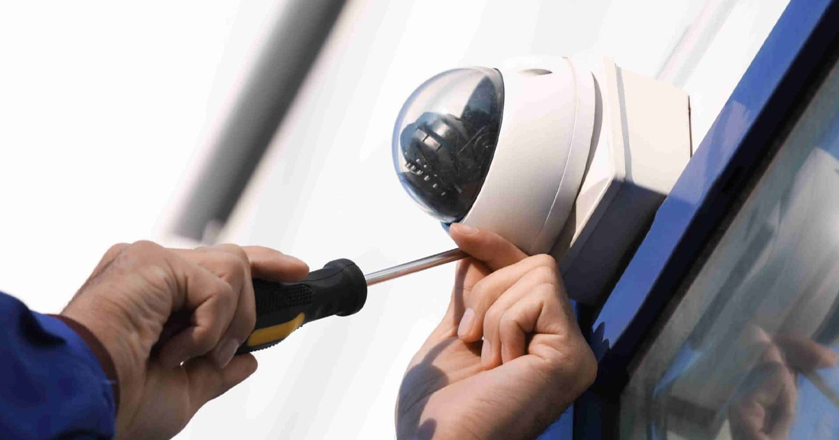 technician installing cctv ip camera exterior building